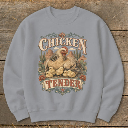 Crewneck sweatshirt with "Chicken Tender" text, hen and chicks illustration, and desert scenery.