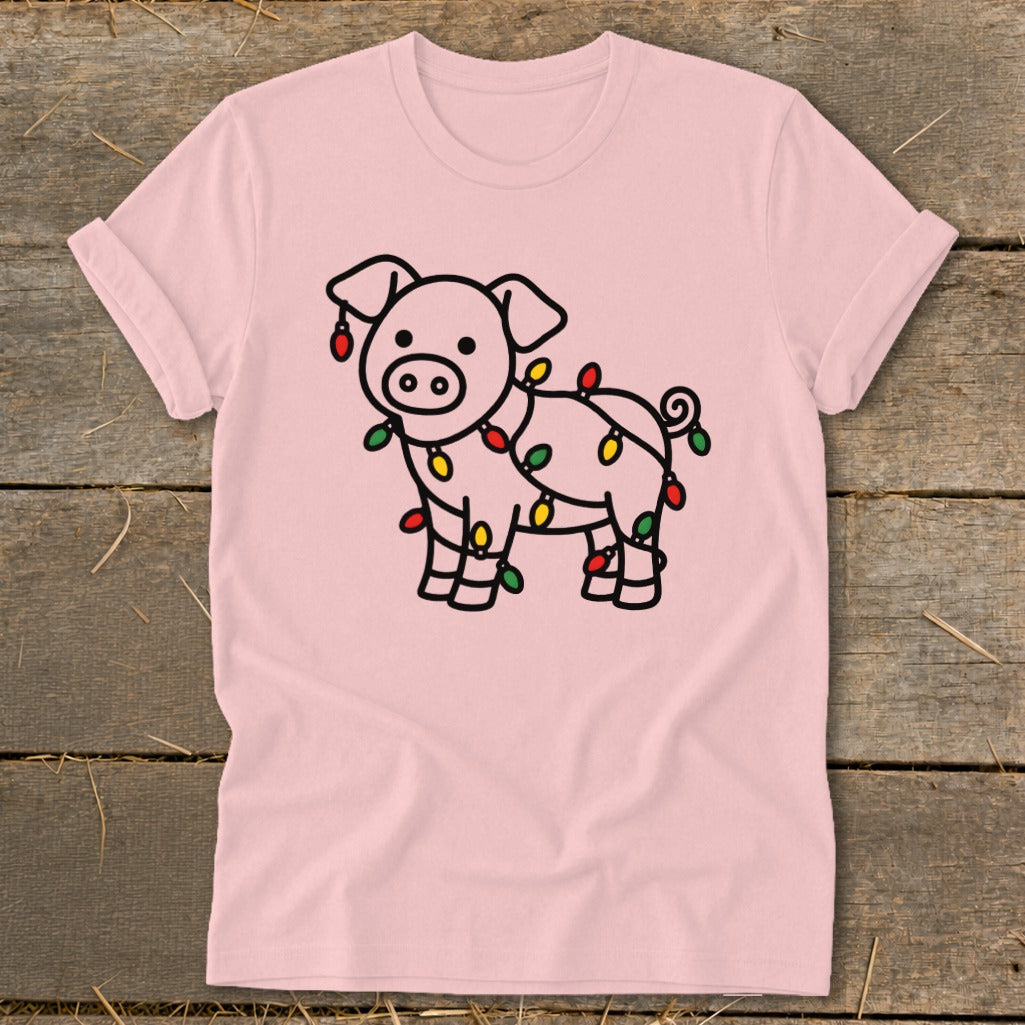 Light pink t-shirt featuring a line drawing of a pig wrapped in Christmas lights.