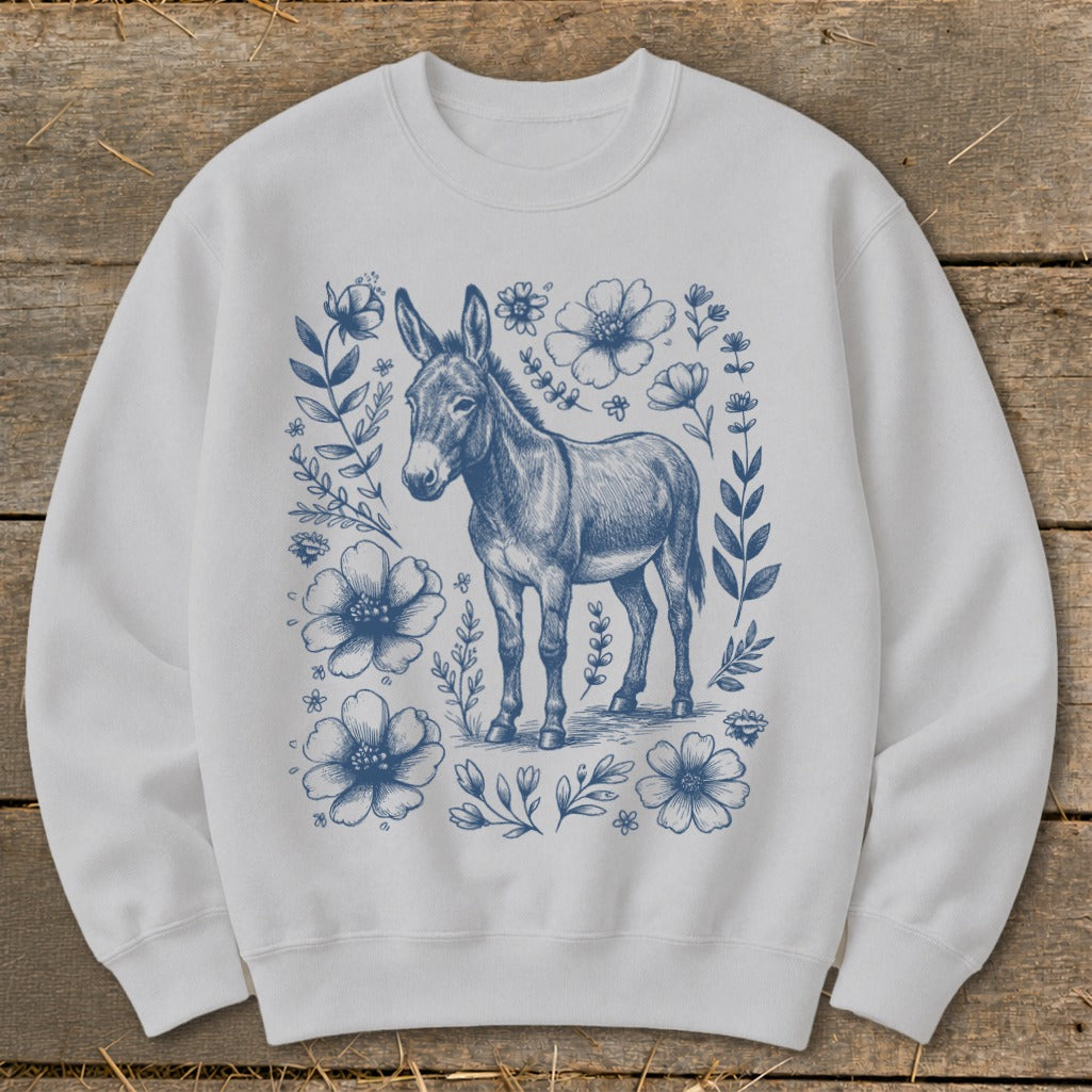 White sweatshirt with a blue donkey and floral sketch design.