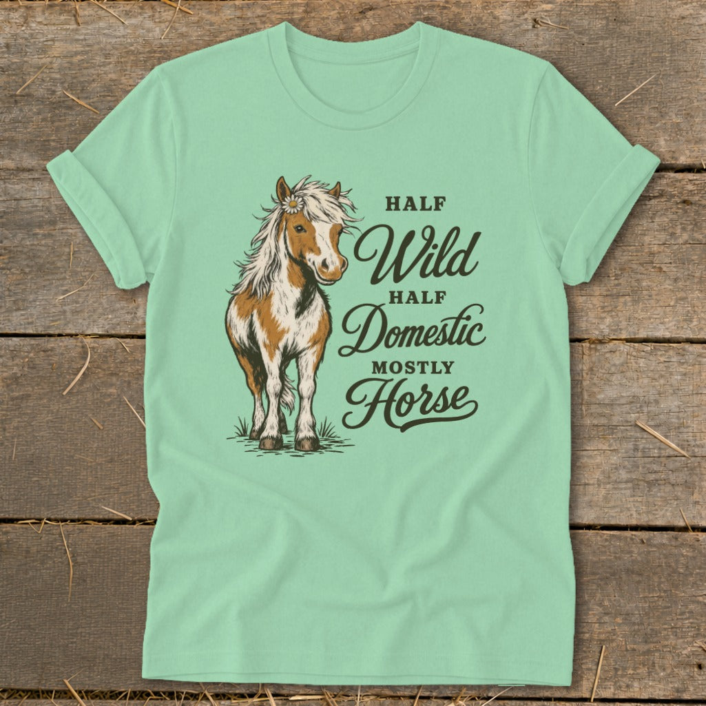 Mint green t-shirt with a horse illustration and text "Half Wild, Half Domestic, Mostly Horse".