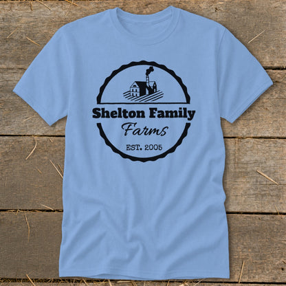 Light blue t-shirt with "Shelton Family Farms EST. 2005" logo and farm graphic.