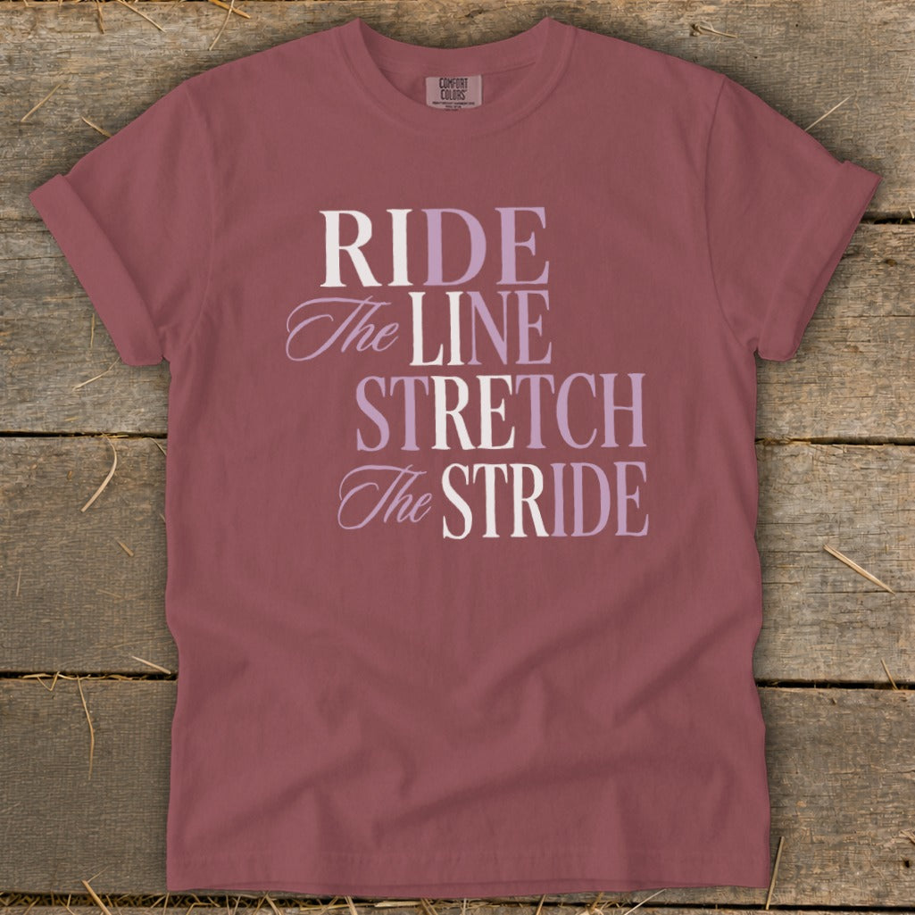 Maroon t-shirt with "RIDE The LINE STRETCH The STRIDE" text.