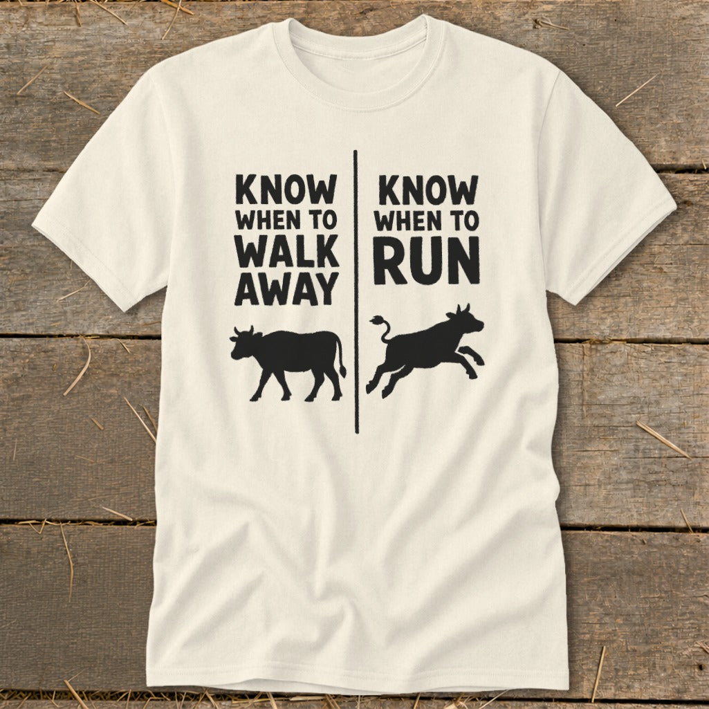 T-shirt with text "Know when to walk away" and "Know when to run" and cow illustrations.