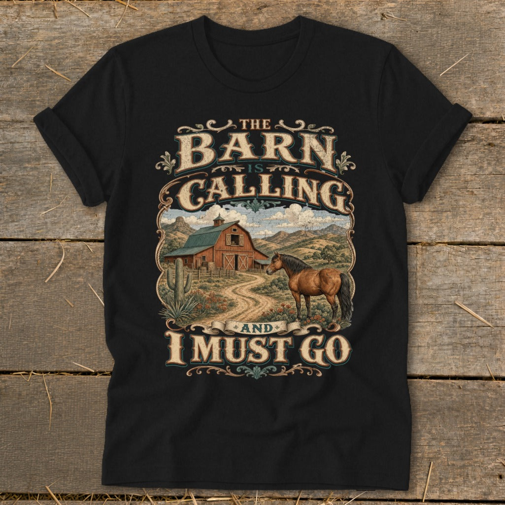 Black t-shirt with "The Barn Is Calling And I Must Go" text and barn, horse, and desert scene graphic.
