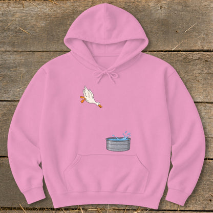 Pink hoodie with cartoon duck leaping into a galvanized water tub graphic.