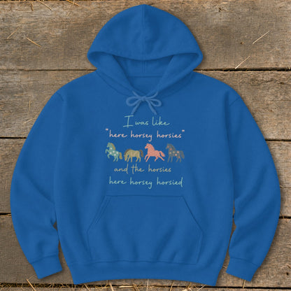 Blue hoodie with text and stylized horse graphics.