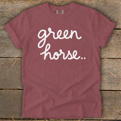 Maroon t-shirt with white script text "green horse.."