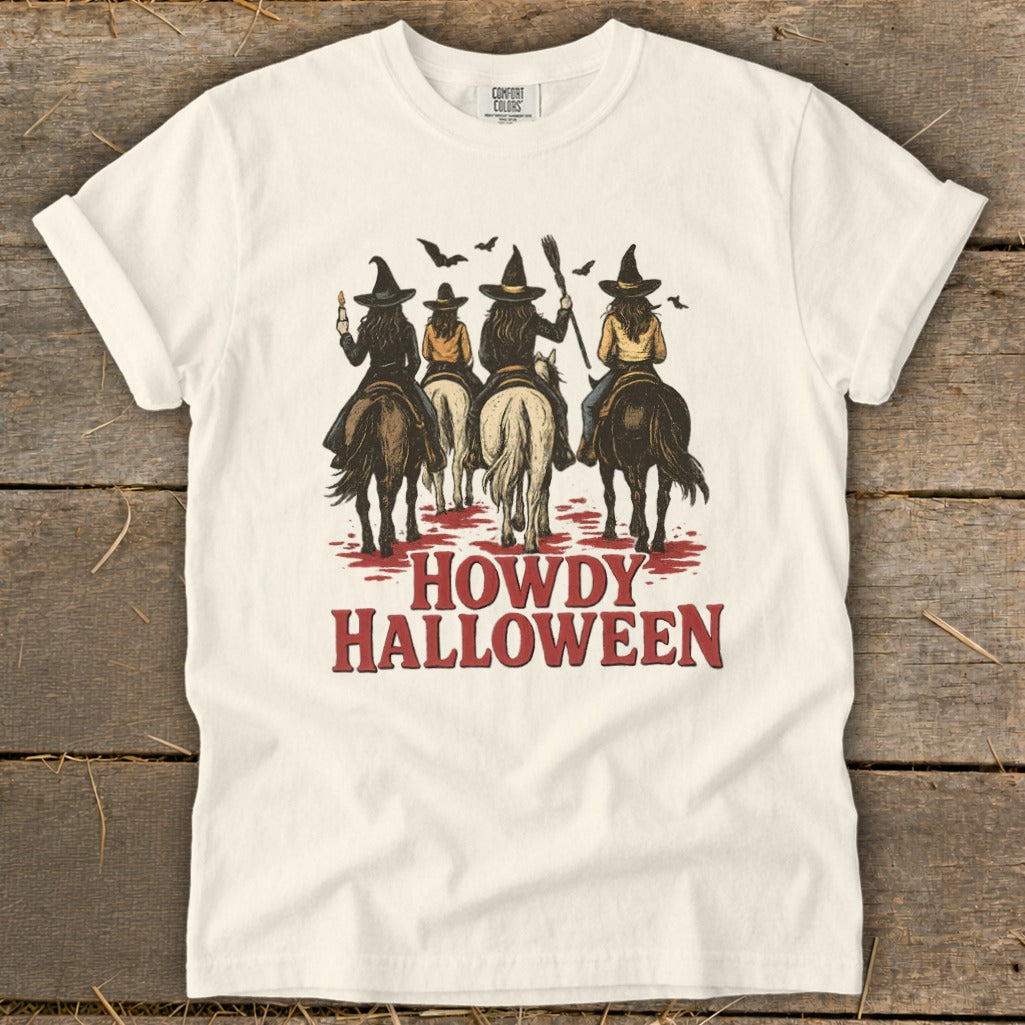 Three witches on horseback with bats above, text "HOWDY HALLOWEEN".
