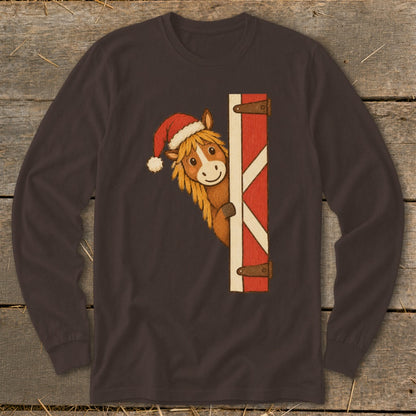 Brown long-sleeve shirt with a cartoon horse wearing a Santa hat peeking from behind a barn door.