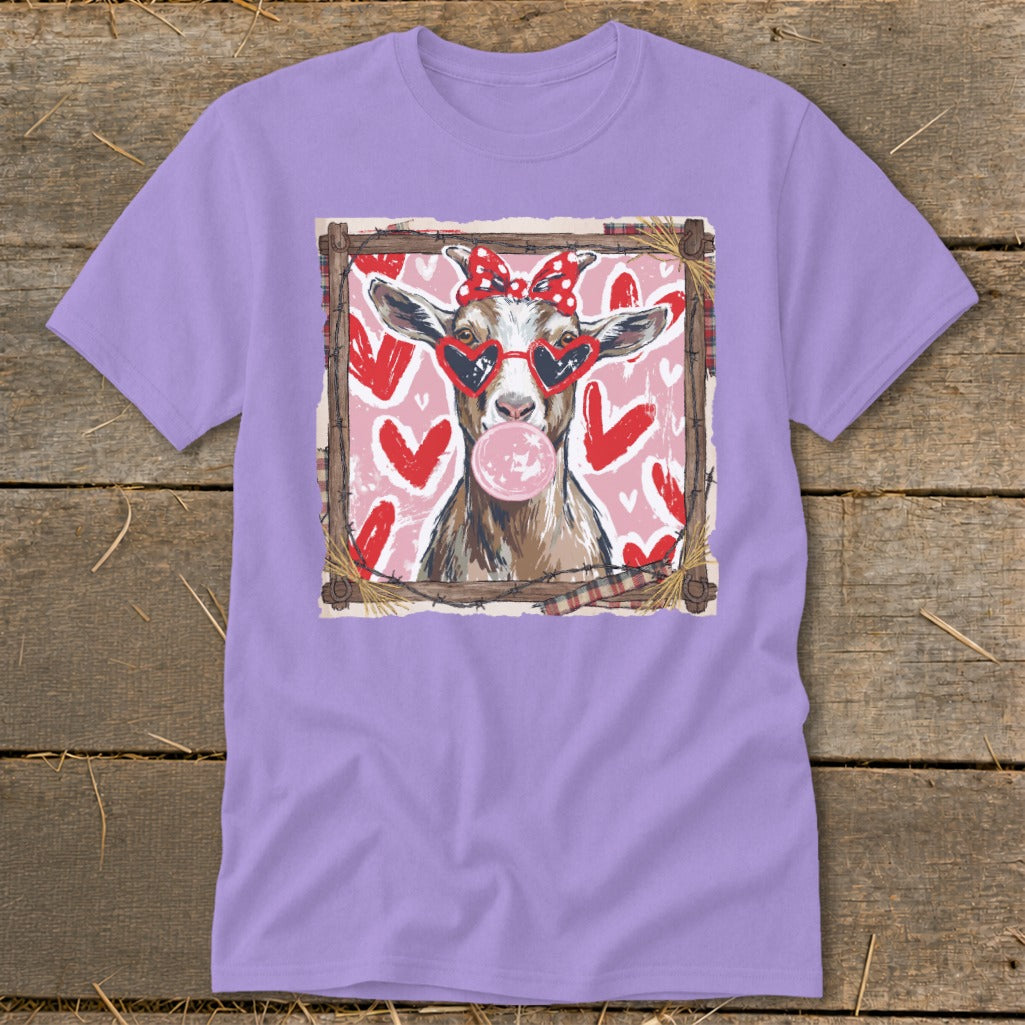 Goat with heart sunglasses and bubble gum on pink background with hearts.