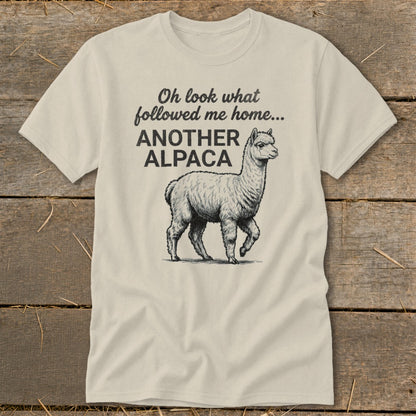 Cream t-shirt with text "Oh look what followed me home... ANOTHER ALPACA" and an alpaca graphic.