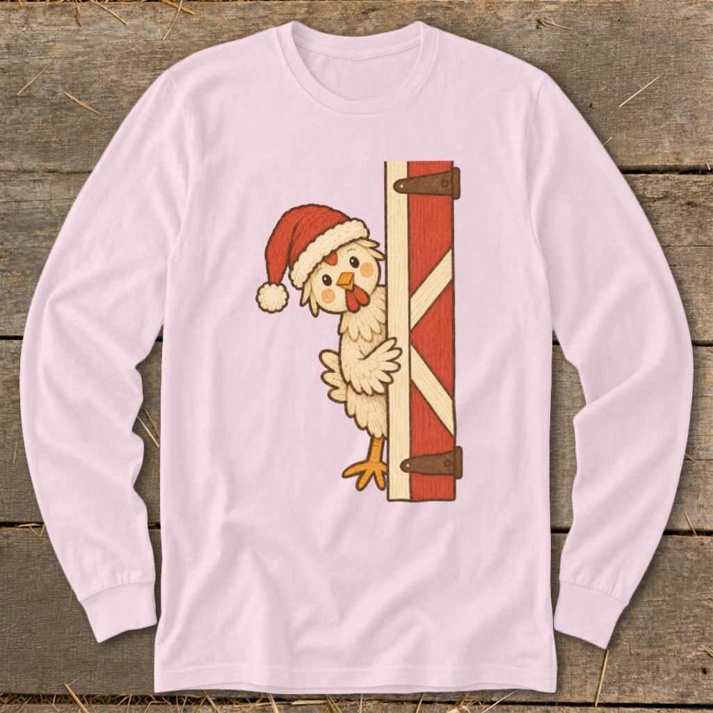 Christmas chicken in Santa hat peeking from behind a red barn door.