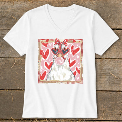 White v-neck t-shirt with a cartoon chicken wearing heart sunglasses and blowing bubblegum.