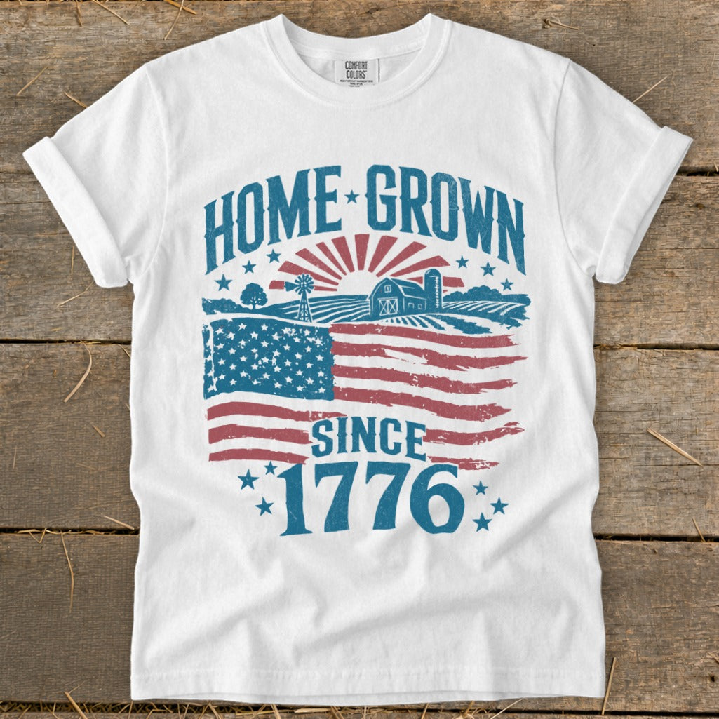 White t-shirt with "HOME GROWN SINCE 1776" design and American flag.