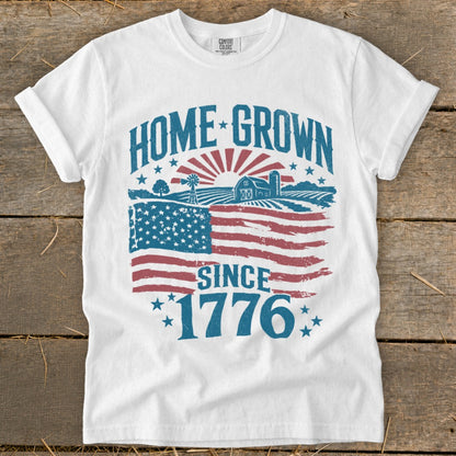 White t-shirt with "HOME GROWN SINCE 1776" design and American flag.