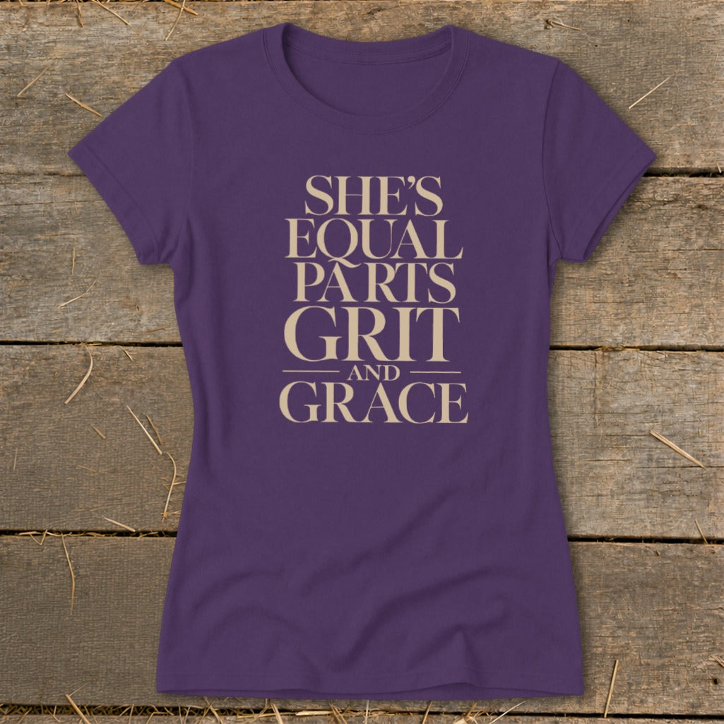 Purple t-shirt with "She's Equal Parts Grit And Grace" text in tan.