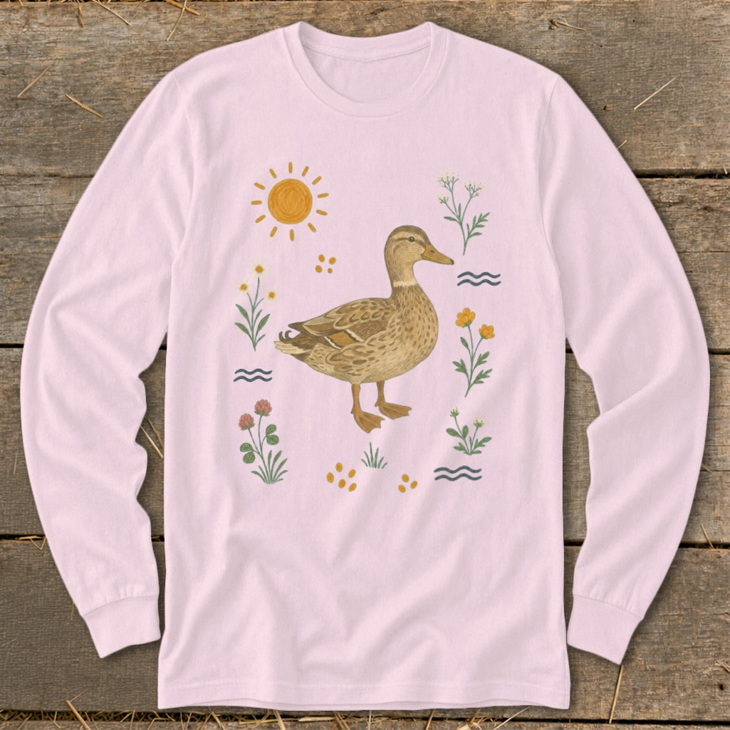 Pink long-sleeve shirt with a mallard duck and floral illustration.