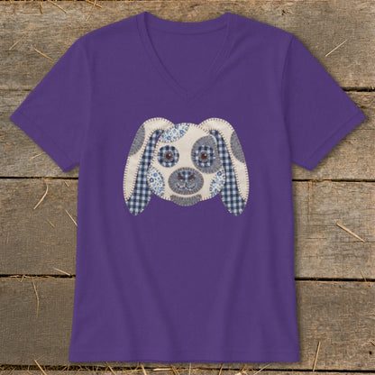 Purple v-neck t-shirt with a patchwork dog face applique.