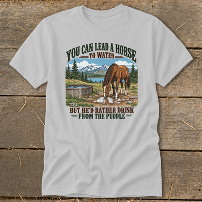 Light gray t-shirt featuring a graphic of a horse drinking from a puddle with text.