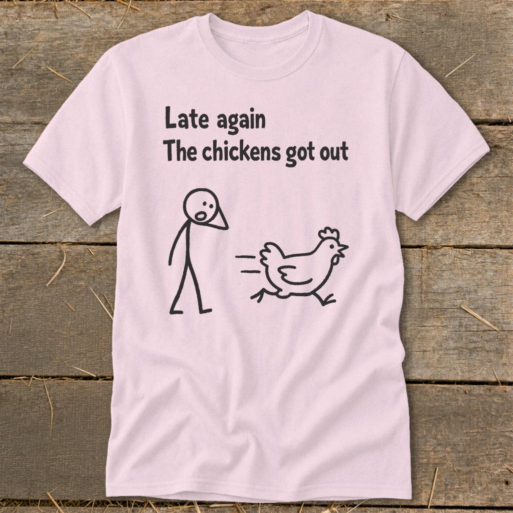 Pink t-shirt with stick figure chasing a chicken and text "Late again, the chickens got out".