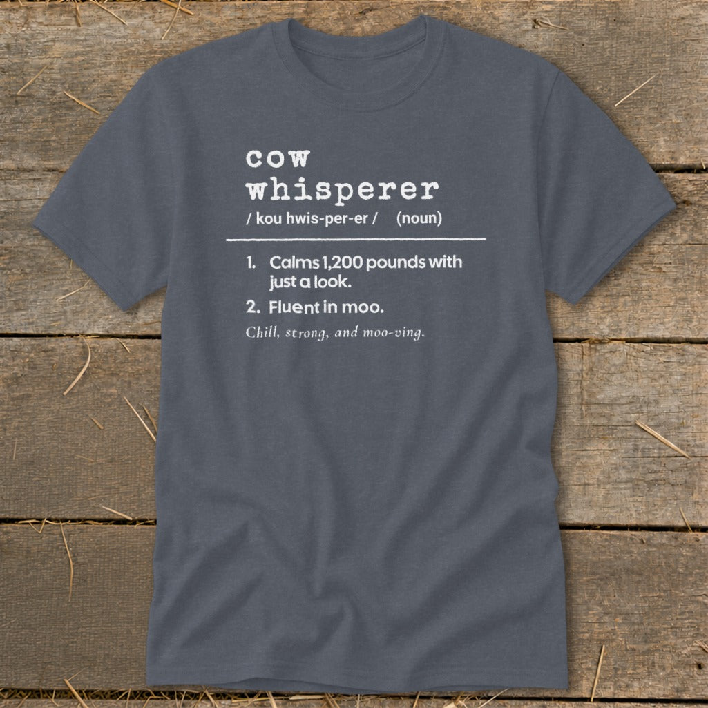 Gray t-shirt with "cow whisperer" definition: calms 1,200 pounds, fluent in moo.