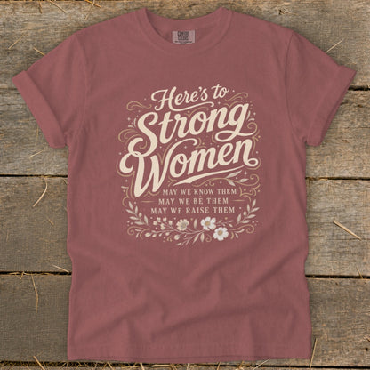 T-shirt with "Here's to Strong Women" graphic and floral accents.