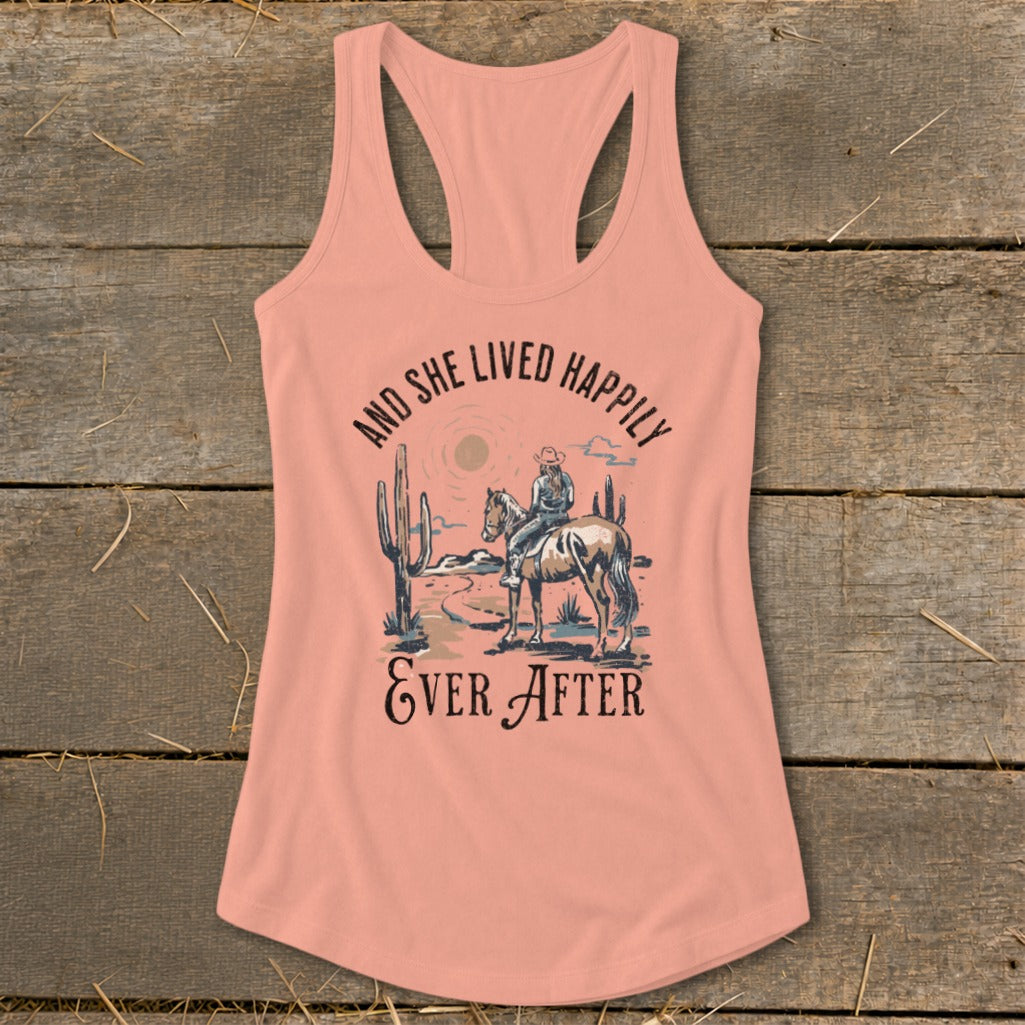 Peach tank top with western scene and text "And She Lived Happily Ever After."