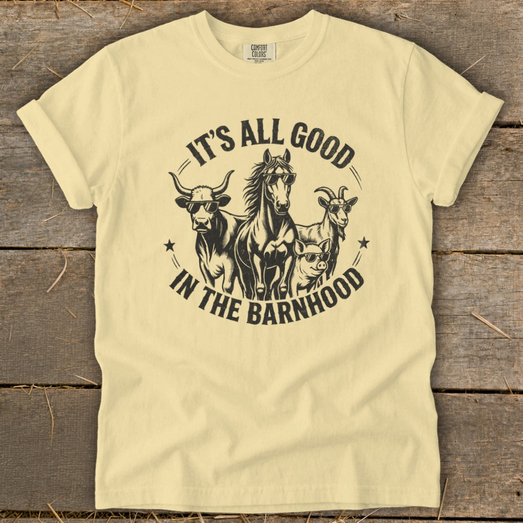 Yellow t-shirt with a graphic of a bull, horse, goat, and pig wearing sunglasses and the text "It's All Good in the Barnhood."