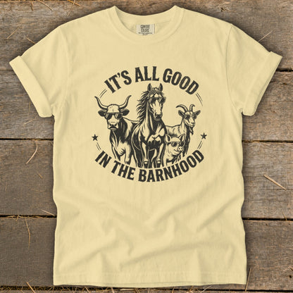 Yellow t-shirt with a graphic of a bull, horse, goat, and pig wearing sunglasses and the text "It's All Good in the Barnhood."