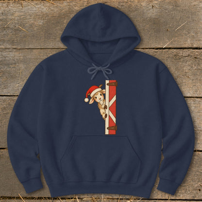 Navy hoodie with a goat in a Santa hat peeking from behind a barn door.