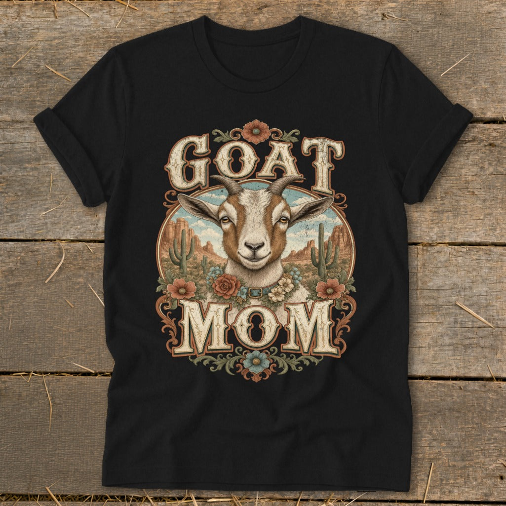 Black t-shirt with a goat, desert cacti, and "GOAT MOM" text.