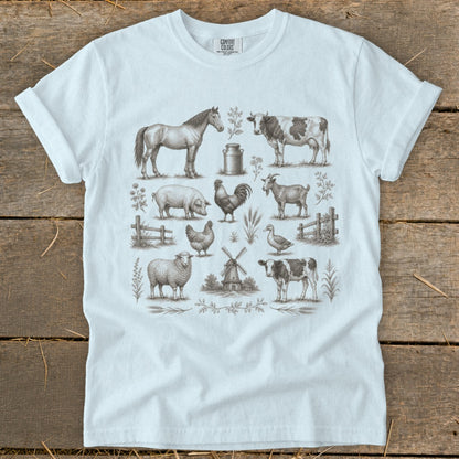 White t-shirt with vintage farm animal illustrations: horse, cow, pig, rooster, goat, sheep, duck, calf.