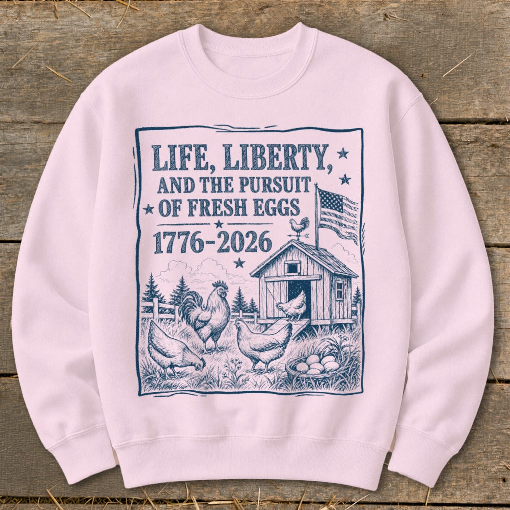Life, Liberty, and the Pursuit of Fresh Eggs graphic with chickens, coop, and American flag.
