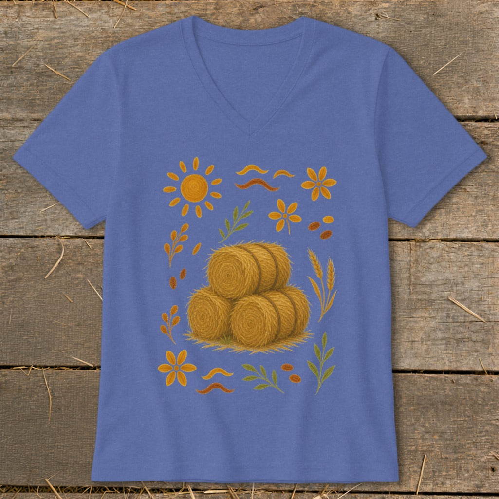 Blue v-neck t-shirt with a stacked hay bale design and autumn accents.