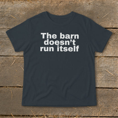 Dark grey t-shirt with white text that reads "The barn doesn't run itself."