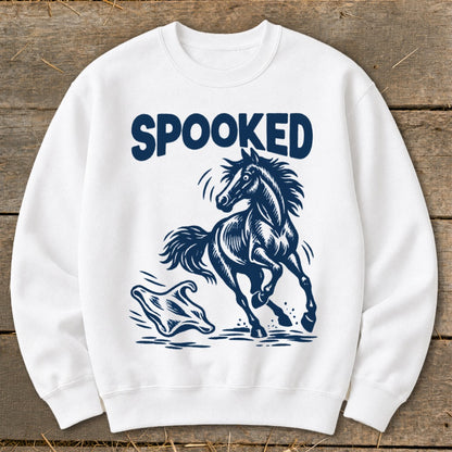 White sweatshirt with "SPOOKED" text and a startled horse facing a ghost.