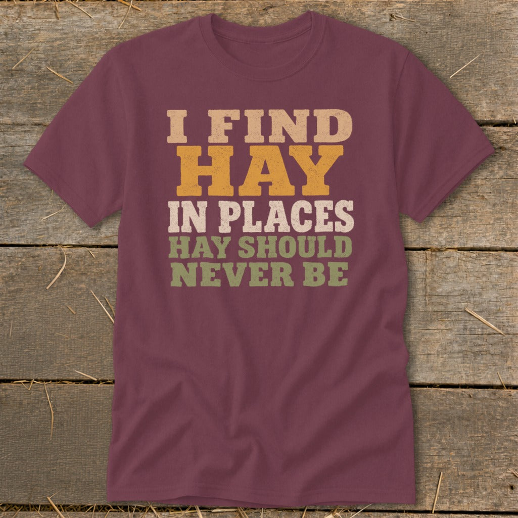 Maroon t-shirt with "I FIND HAY IN PLACES HAY SHOULD NEVER BE" text.