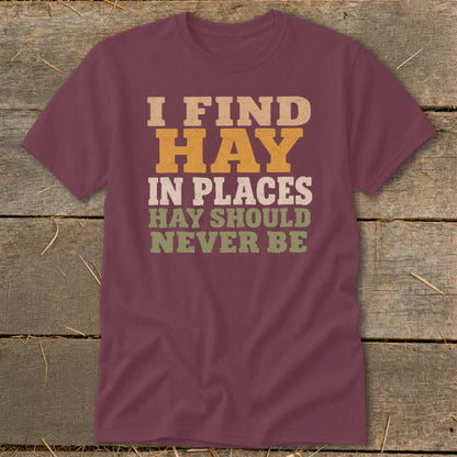 Maroon t-shirt with "I FIND HAY IN PLACES HAY SHOULD NEVER BE" text.