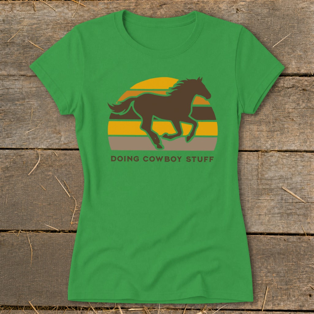 Green t-shirt with a brown horse silhouette and "DOING COWBOY STUFF" text.