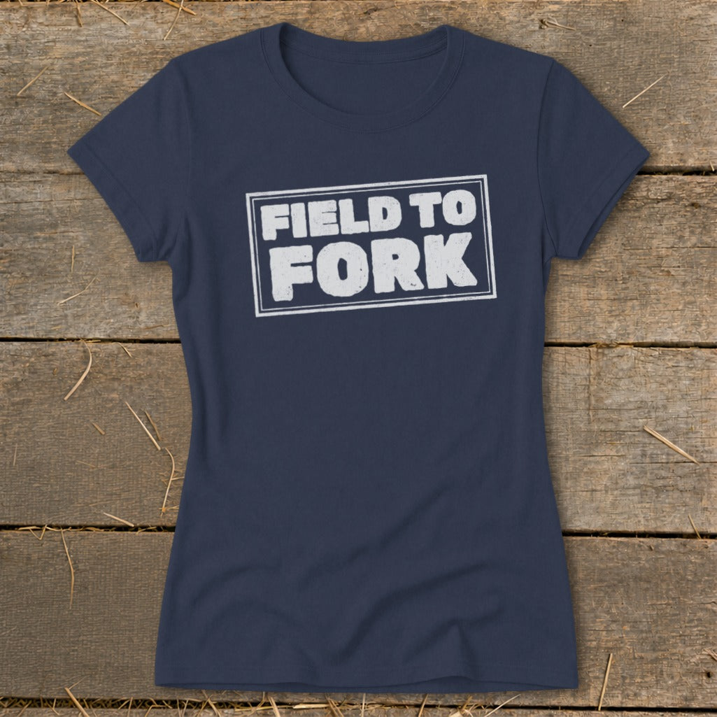 Navy blue short-sleeved t-shirt with a distressed white box graphic that reads FIELD TO FORK.