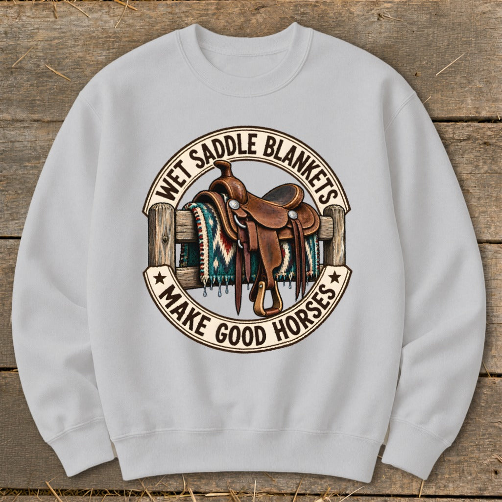 Light grey sweatshirt with a circular graphic of a western saddle on a fence with a patterned blanket.
