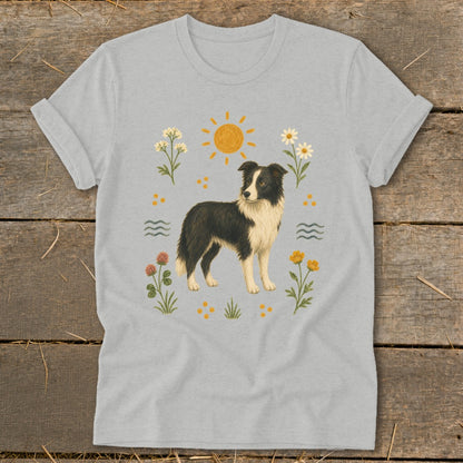 Grey t-shirt with illustration of a black and white border collie surrounded by flowers.
