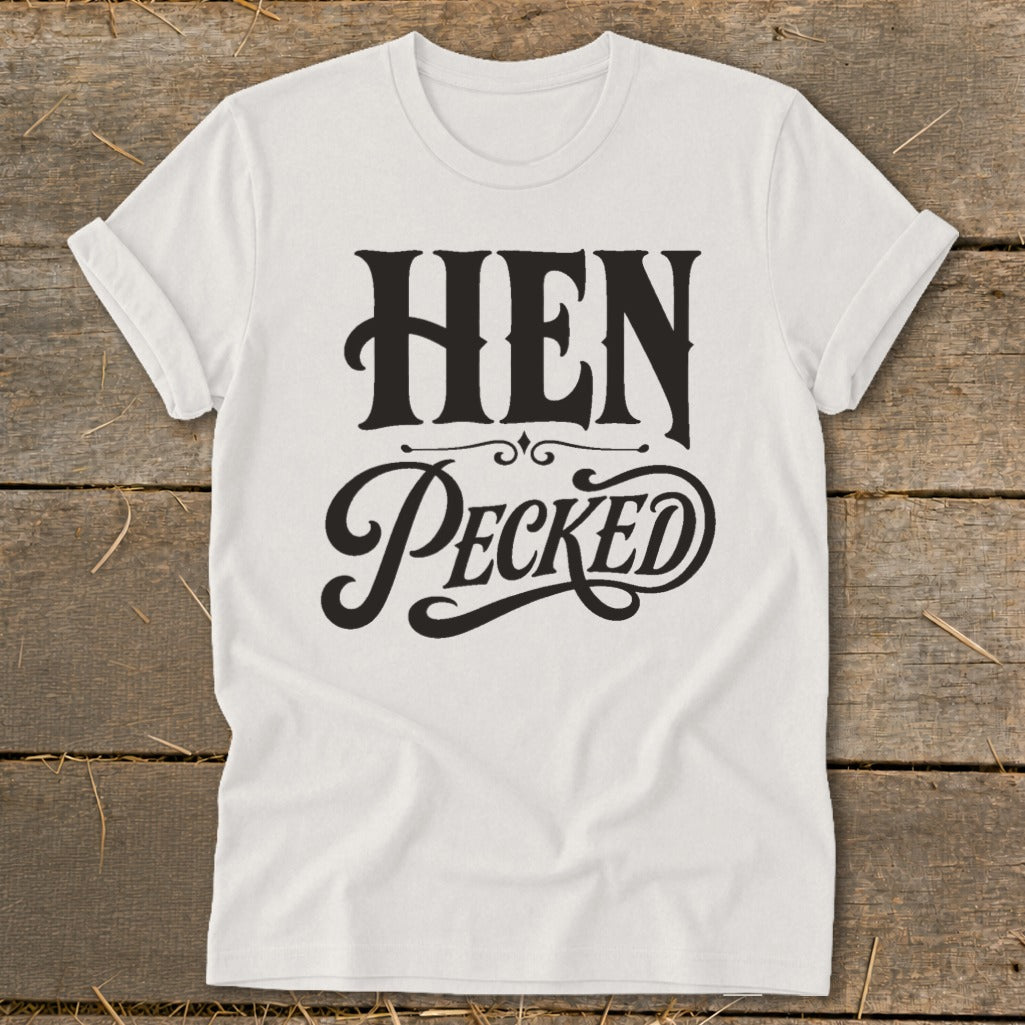 White t-shirt with black text reading "HEN PECKED" in decorative fonts.