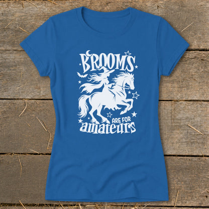 Blue t-shirt with white graphic of a witch riding a horse, "Brooms are for amateurs."
