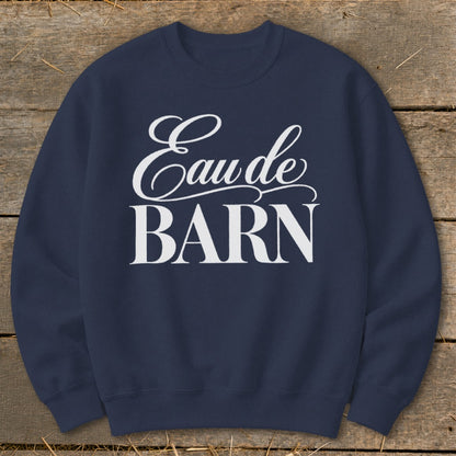Navy sweatshirt with white "Eau de BARN" text in a decorative font.