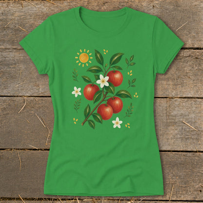 Green t-shirt with a stylized apple branch, white flowers, and yellow sun graphic.