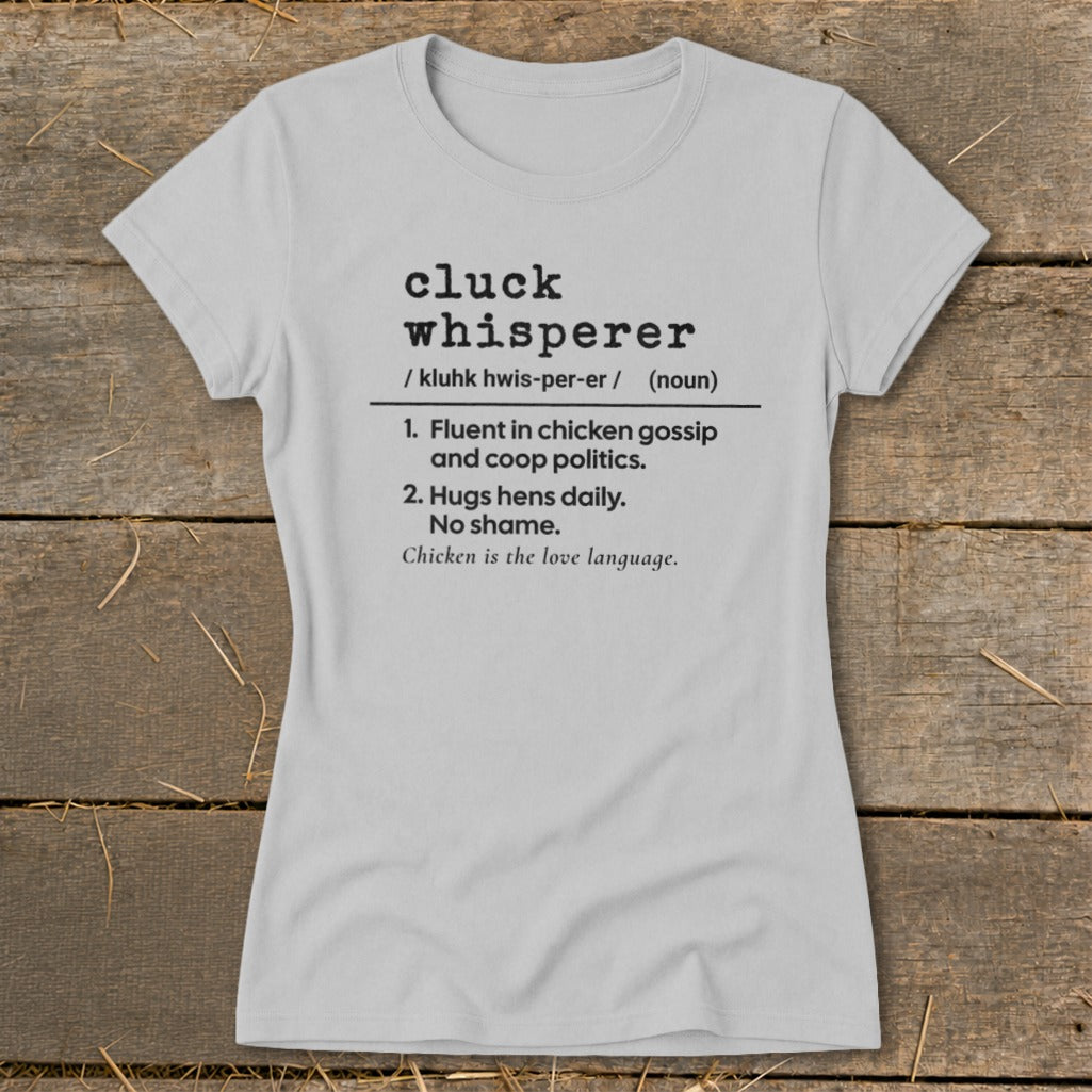 Light grey t-shirt with "cluck whisperer" definition and chicken saying.