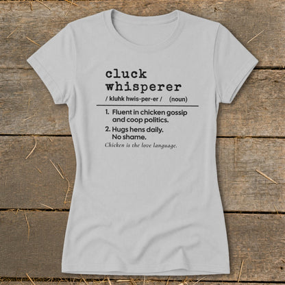 Light grey t-shirt with "cluck whisperer" definition and chicken saying.