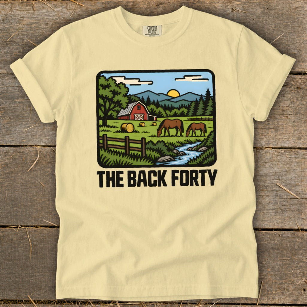 A cream-colored t-shirt with a graphic of a farm scene and the text THE BACK FORTY.