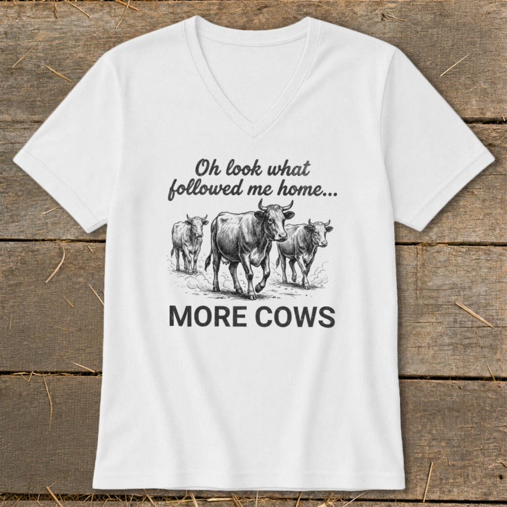 White t-shirt with cows and text "Oh look what followed me home... MORE COWS".